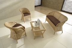 divano in midollino e rattan con cuscino